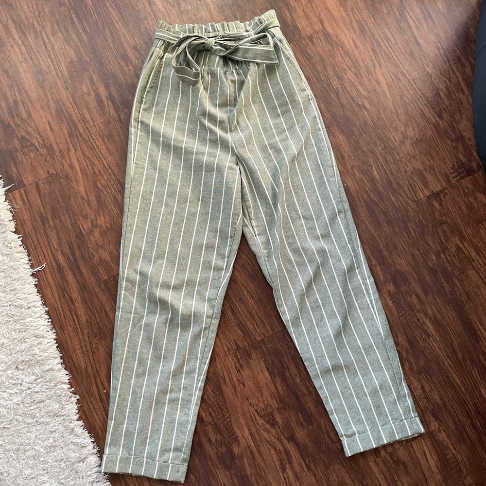 Green and white trousers with a tie at the top!
